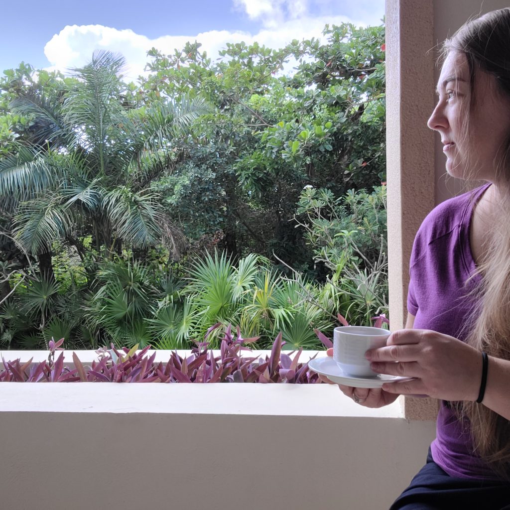 Tasha sitting on patio with tea cup
