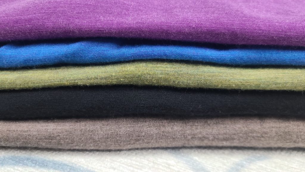 Pile of Merino wool clothing
