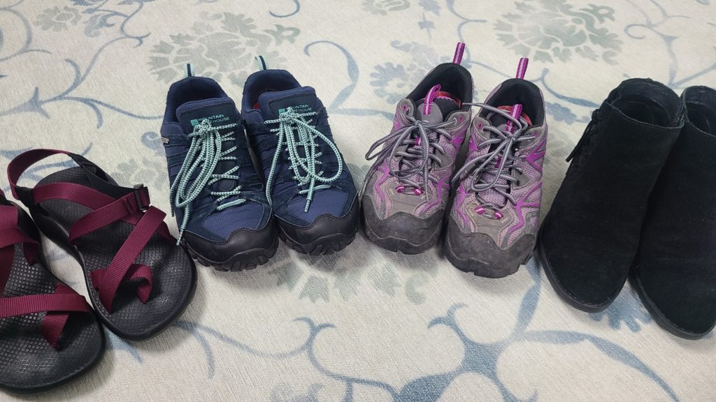 Line up of sandals, hiking shoes and walking booties