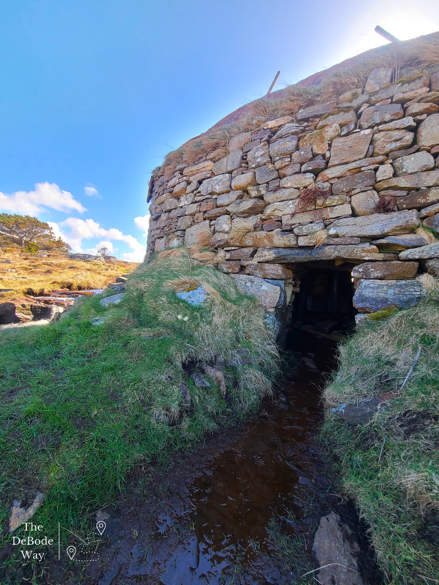 Backside of stone flour mill where water moves through to turn the paddle wheel