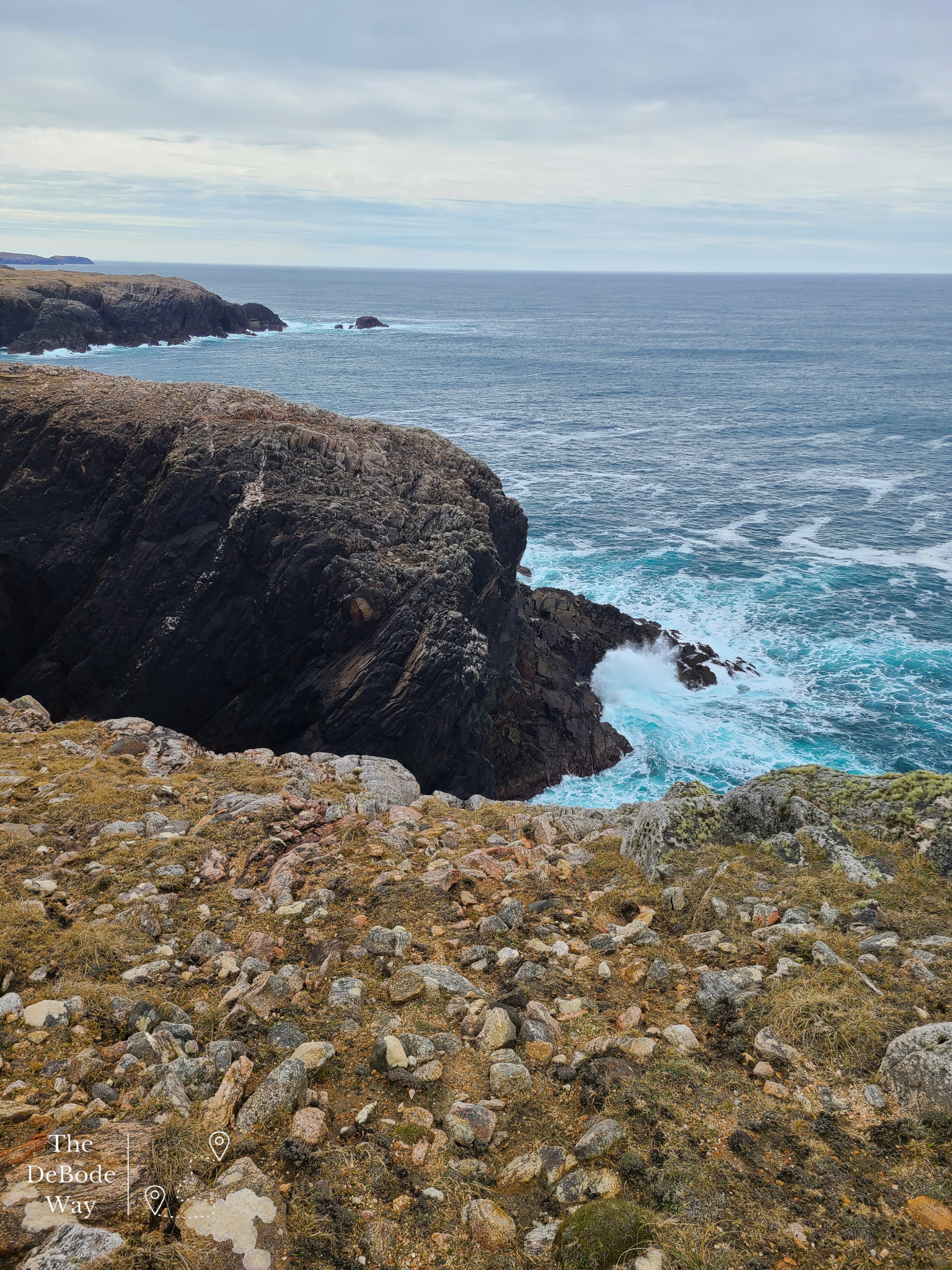 Waves crashing onto the cliff from top of Gallan Head