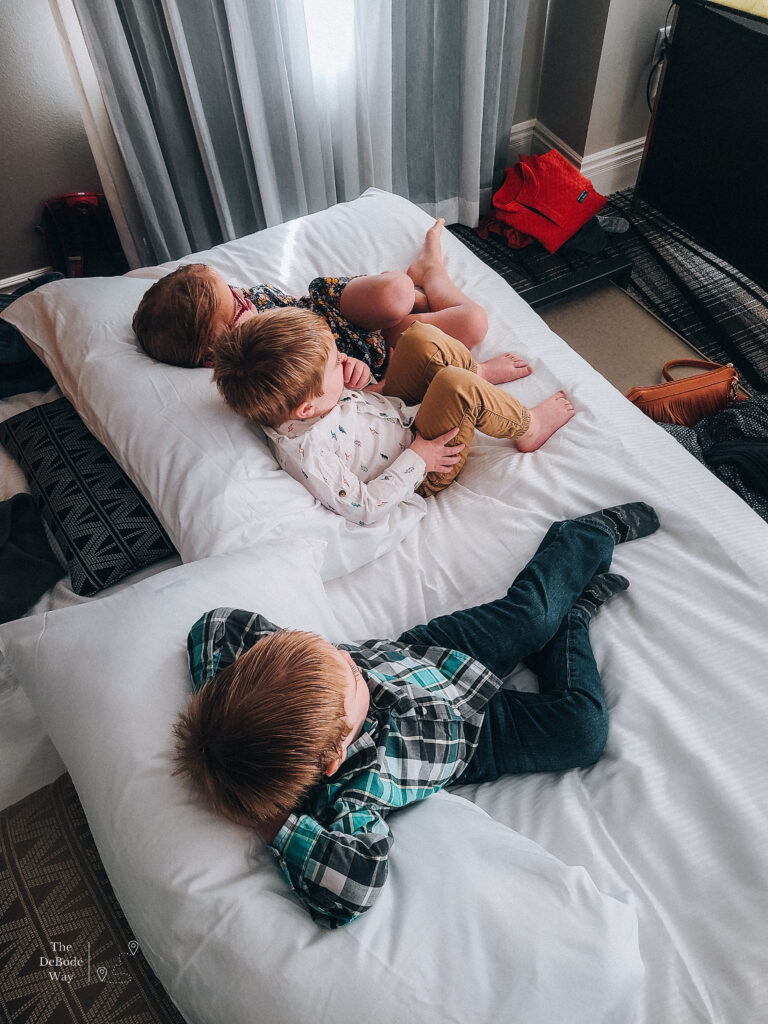 Kids chilling on the bed - The Warrior Hotel Sioux City Iowa - Siouxland
