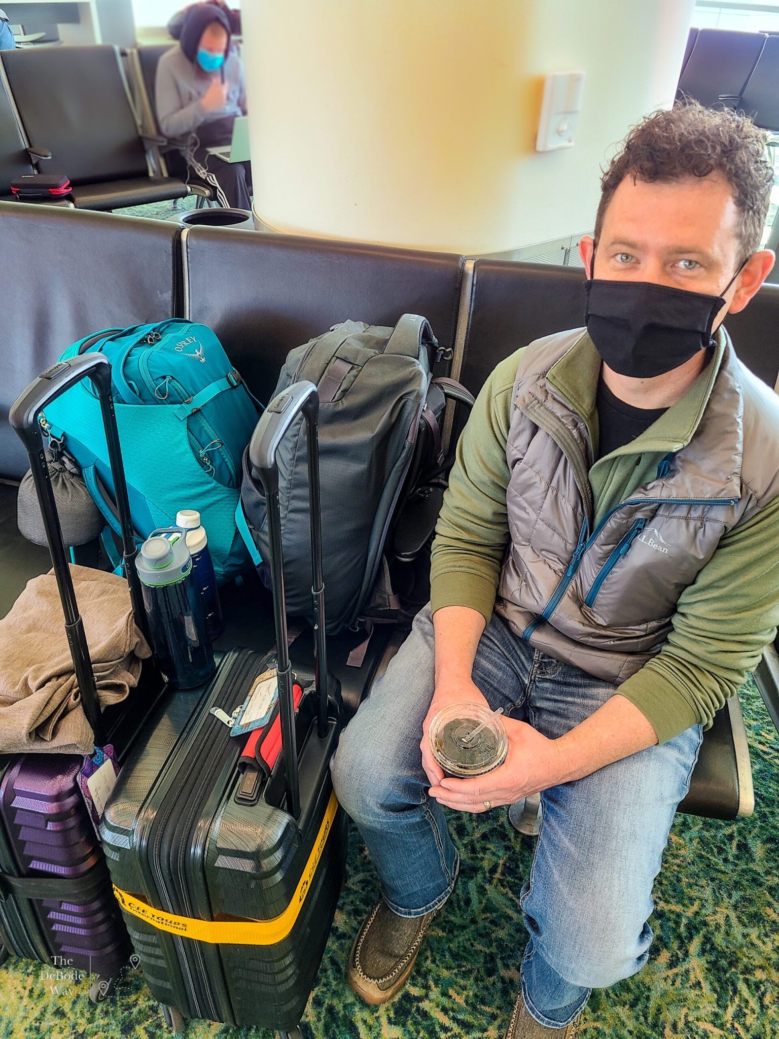 Jason with our carry-on luggage and travel backpack