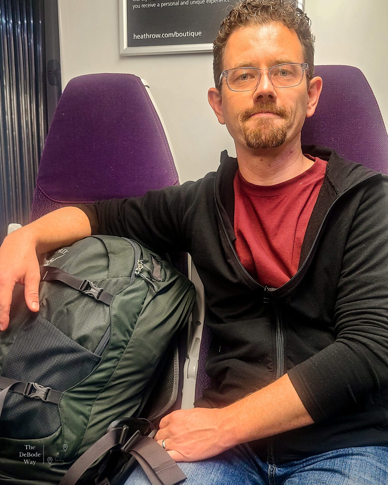 Jason with his travel backpack on the train