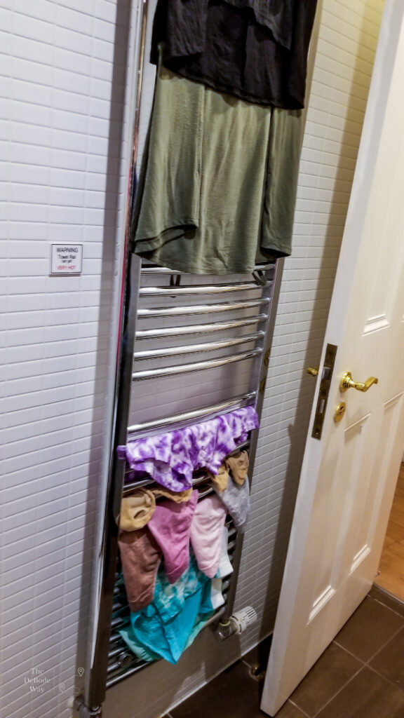 clothes drying on the heated towel rack