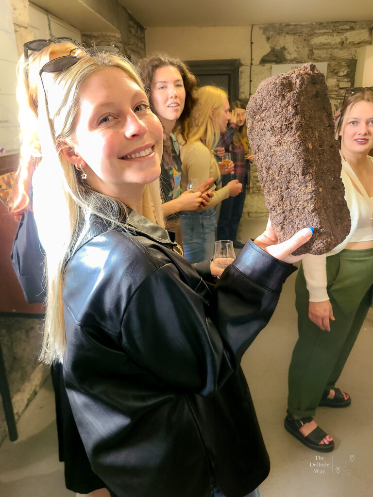 Student with a block of peat