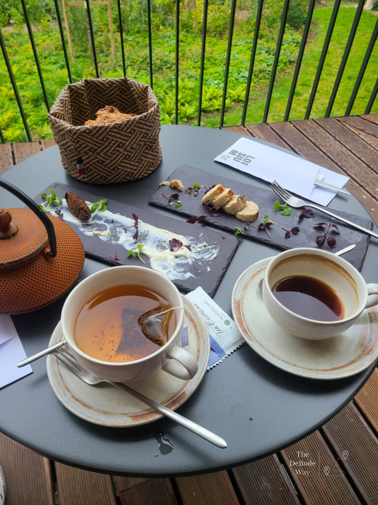 Afternoon snack - tea, coffee, bread, white sausage, and falafel