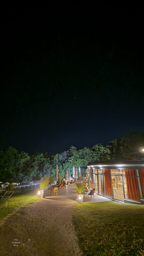 The outdoor patio at the restaurant at Domaine de la Tortiniere at night