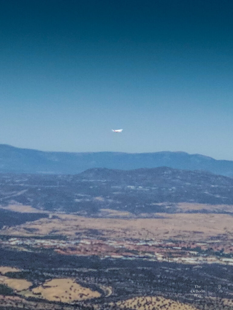 A plane taking off over the desert at Madrid airport