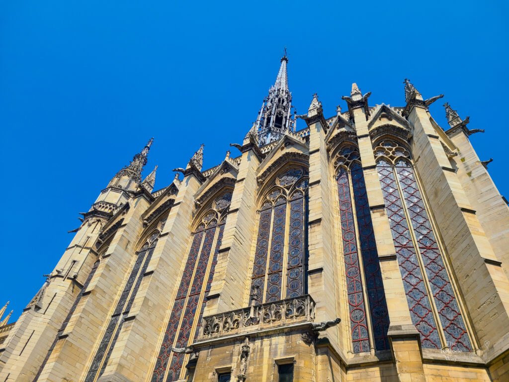 The outside Gothic structure of Sainte Chapelle with its spire reaching to the sky