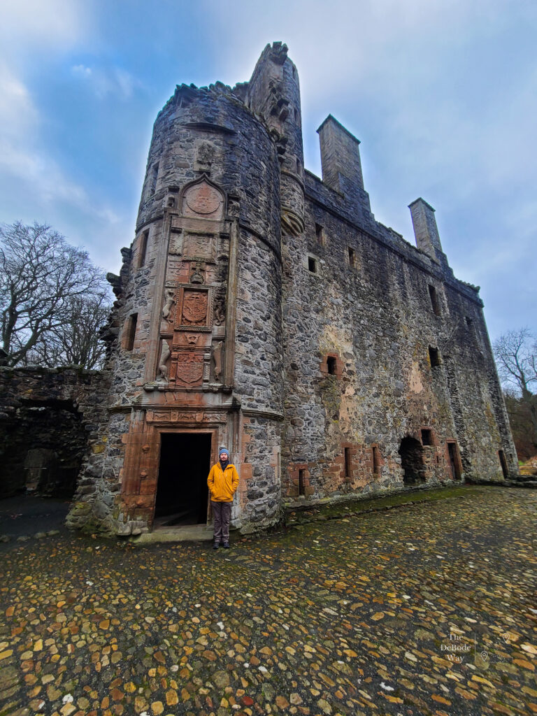 Jason in the courtyard of Huntly Castle with the castle in the background