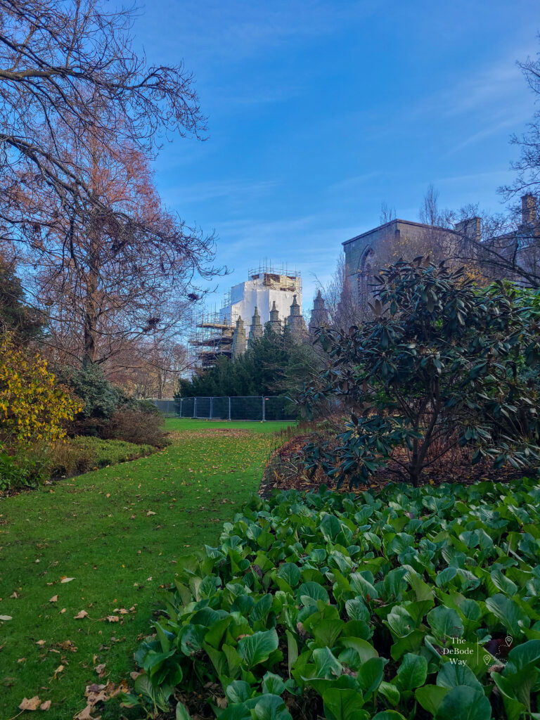 Gardens of Holyrood Palace in November with the chapel under scaffolding in the distance