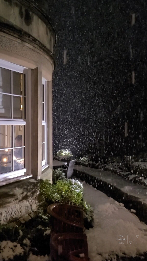 Falling snow outside of of Dowans House