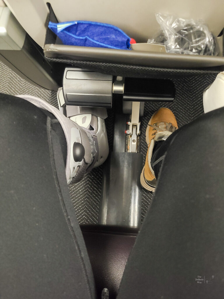 Plenty of knee space in United's Premium Plus seating with a walking boot - looking down at legs
