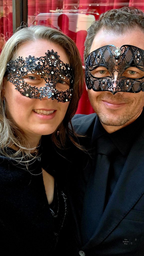 Tasha and Jason in masquerade masks and black tie in New York City
