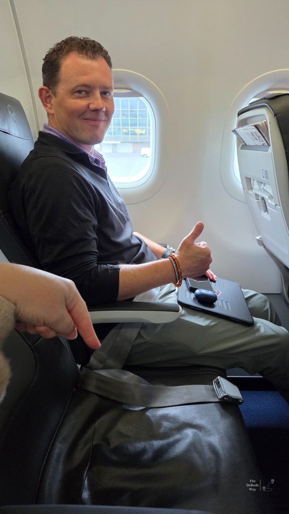 Our journey home began with an empty middle seat, thumbs up from Jason.
