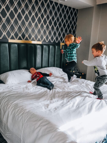 Kids on the bed - The Warrior Hotel Sioux City Iowa - Siouxland
