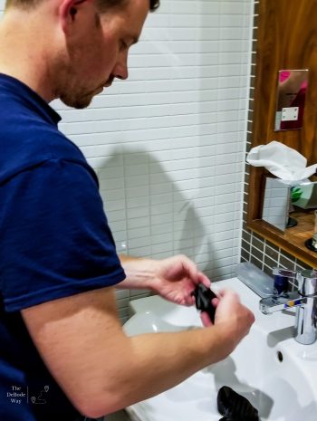 Jason doing our travel laundry in the sink