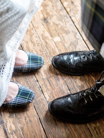 Gordon tartan women's flat shoes and traditional black lace-up men's shoes