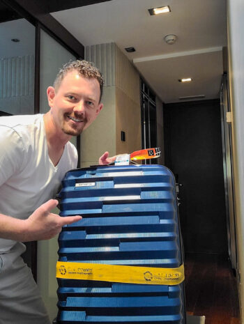 Jason with his lost luggage that finally arrived at his hotel