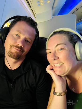 Jason and Tasha with noise-cancelling headphones on during the flight home from Paris