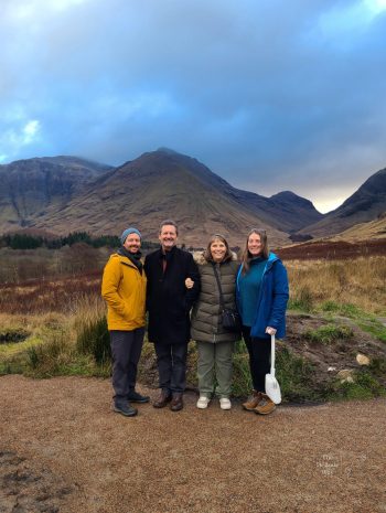 Jason, Doug, Sandy, and Tasha standing in Glen Coe with the mountains in the background