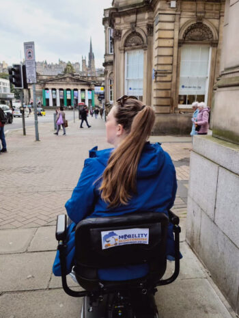 Tasha on a mobility scooter for disabled travel in Edinburgh