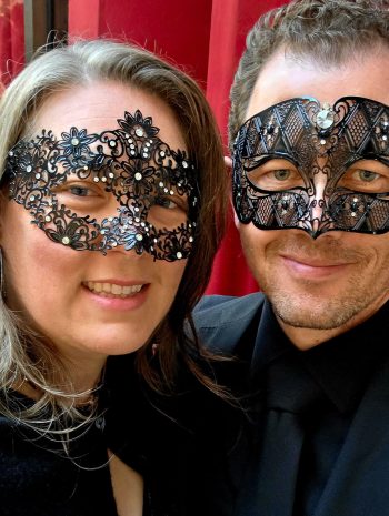 Tasha and Jason in New York City in masquerade masks and black tie